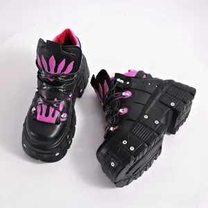 Gothic punk platform shoes with fuchsia flame patterns and metallic stud details