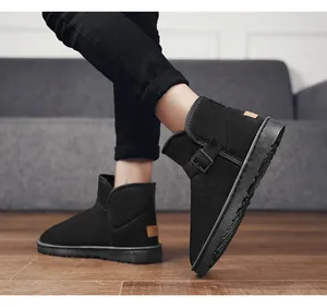 Detailed view of black suede snow boots with a stylish side buckle and warm lining.