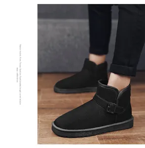 Macro detail of black suede snow boot featuring a stylish buckle strap and warm interior