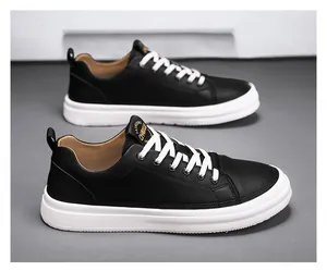 Side view detail of premium black leather low-top casual sneakers for men with white soles