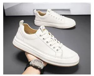 Detailed side view of high-quality white leather low-top casual sneakers for men