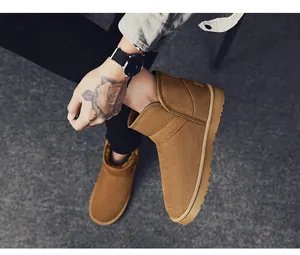 Stylish brown suede snow boots for men featuring warm fleece lining and durable soles