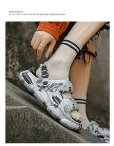 Close-up of men's platform slides with graffiti print and adjustable heel strap.