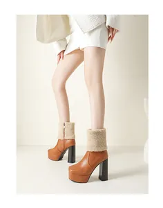 Stylish women wearing brown platform ankle boots with thick heels and faux fur trim.
