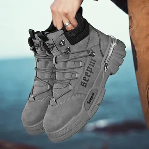 Durable grey suede high-top work boots with thick soles and lace-up design
