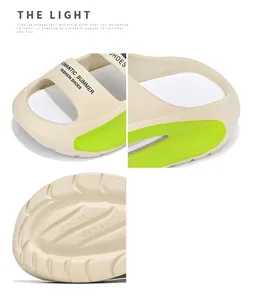Detailed close-up of beige EVA slides showing sole size markings and neon green accents