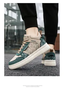 Detailed view of men's stylish high-top sneakers featuring paisley print and green canvas