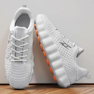 Breathable white chunky sneakers for couples with orange sole accents and outdoor design
