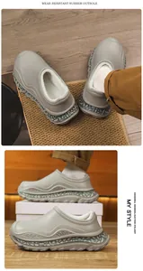 Detail of grey winter slippers with thick plush lining and wear-resistant rubber outsole.