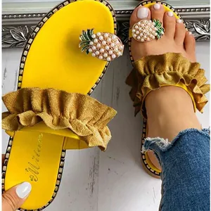 Stylish yellow flat flip-flop sandals for women with pearl pineapple and ruffle details