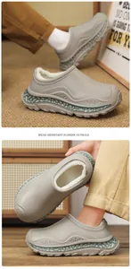 Detail of grey fleece-lined slippers with a thick, wear-resistant rubber outsole for winter.