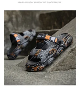 Close-up of trendy men's outdoor non-slip sandals with thick sole and graffiti print