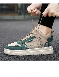 Detail of men's high-top sneaker with green paisley pattern and thick white sole