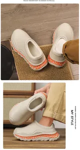 Detailed view of winter fleece-lined clogs featuring wear-resistant orange rubber soles.