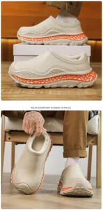 Close-up detail of beige fleece-lined winter clogs showing wear-resistant orange outsole
