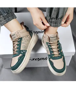 Close-up of green paisley pattern high-top sneakers for men with beige accents