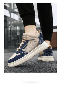 Detailed view of stylish men's high-top sneakers with blue paisley pattern design