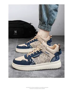 Close-up view of men's paisley high-top canvas sneakers on model