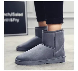 Close-up of grey suede snow boots for men and women, featuring warm padded interior