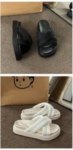 Detailed comparison of black and white platform sandals featuring thick soles and cross straps