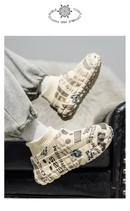 Graffiti-print chunky platform cotton clogs with a plush lining and knit sock collar.