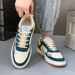 Stylish men's leather skateboard sneakers in off-white and teal with rope laces