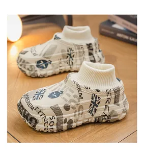 Detail of stylish platform winter slippers with newsprint pattern and warm knit collar