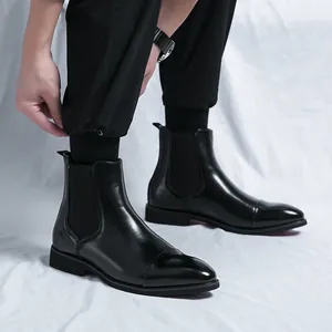 Classic men's black leather Chelsea boots with cap toe and thick sole design