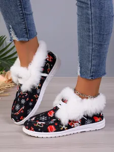 Close-up detail of Christmas themed fur-lined warm cotton shoes with thick white soles