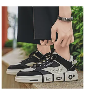 Side view of black and white fashion sneakers for men with bold logo details