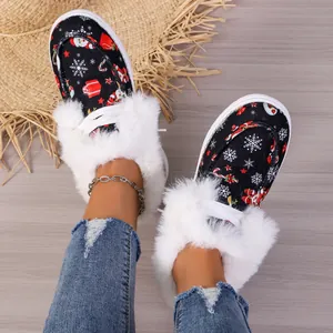 Close-up of Christmas patterned warm boots with white faux fur lining and laces