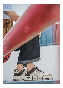 Close-up view of trendy men's patchwork sneakers with soft soles