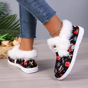 Detailed view of Christmas themed warm boots with white faux fur lining and thick soles