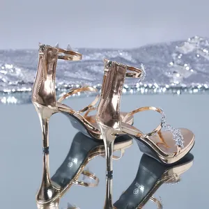 Elegant rose gold stiletto sandals with sparkling rhinestone stars and back zipper detail