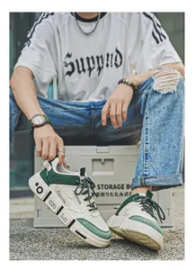 Close-up of trendy green and white men's sneakers in a lifestyle urban setting.