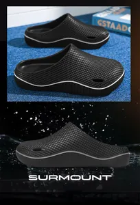 Professional black non-slip clogs for men featuring waterproof textured surface detail