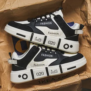 Trendy black and white men's sneakers with chunky soles and fashion prints, urban style.