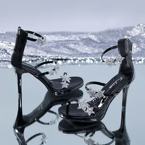 Detail shot of elegant black platform stiletto sandals with sparkling rhinestone stars.