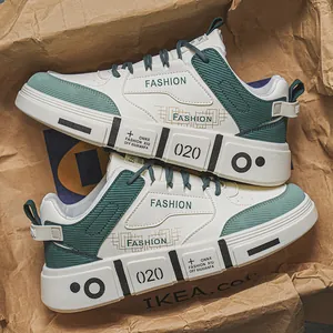 Trendy men's white and green sneakers with soft soles, perfect for streetwear and casual wear.