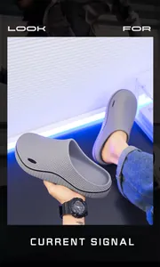 Detail of gray men's non-slip chef clogs with thick cushioned sole and textured upper.