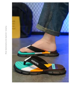 Close-up of men's colorful flip-flops for outdoor beach wear with anti-slip sole.