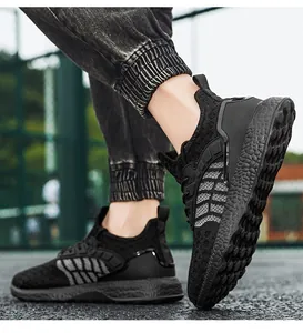 Close-up view of black breathable fly-knit lightweight running shoes for sports
