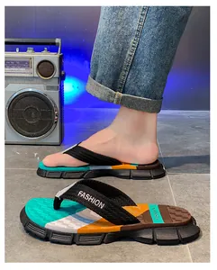 Detailed view of stylish men's outdoor color-blocked flip-flops with anti-slip thick soles