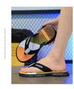Detailed view of men's non-slip flip-flops featuring a stylish color-blocked design and woven straps
