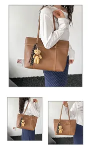 Stylish minimalist brown faux leather tote bag with striped tassel and teddy bear charm