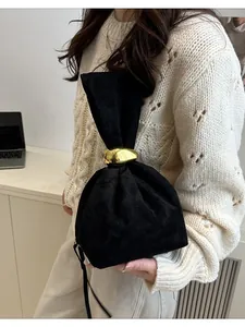 Elegant black suede pouch handbag with gold metallic buckle, retro pleated design for women