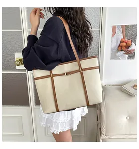 Stylish minimalist cream white tote bag for women shown in a lifestyle indoor setting