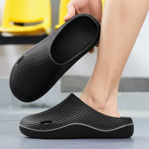 Professional black non-slip clogs for men with breathable grid texture and platform sole