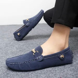 Stylish navy blue suede loafers for men with elegant metal buckle and cat logo detail
