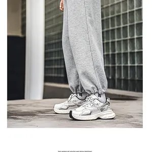 Modern white and silver chunky sneakers for men, stylish and breathable sport dad shoes for youth